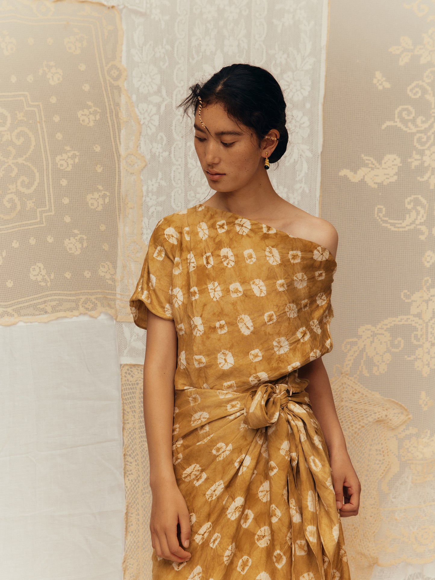 Asymmetric diagonal neckline top