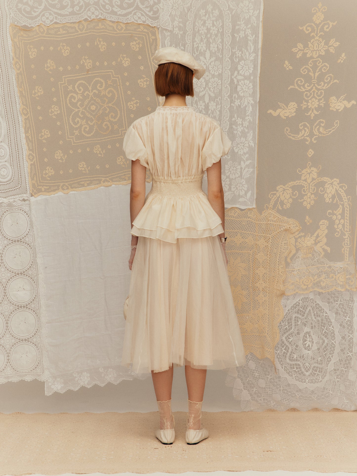 Sleeveless silk cotton top with a ruched collar and a cinched waist