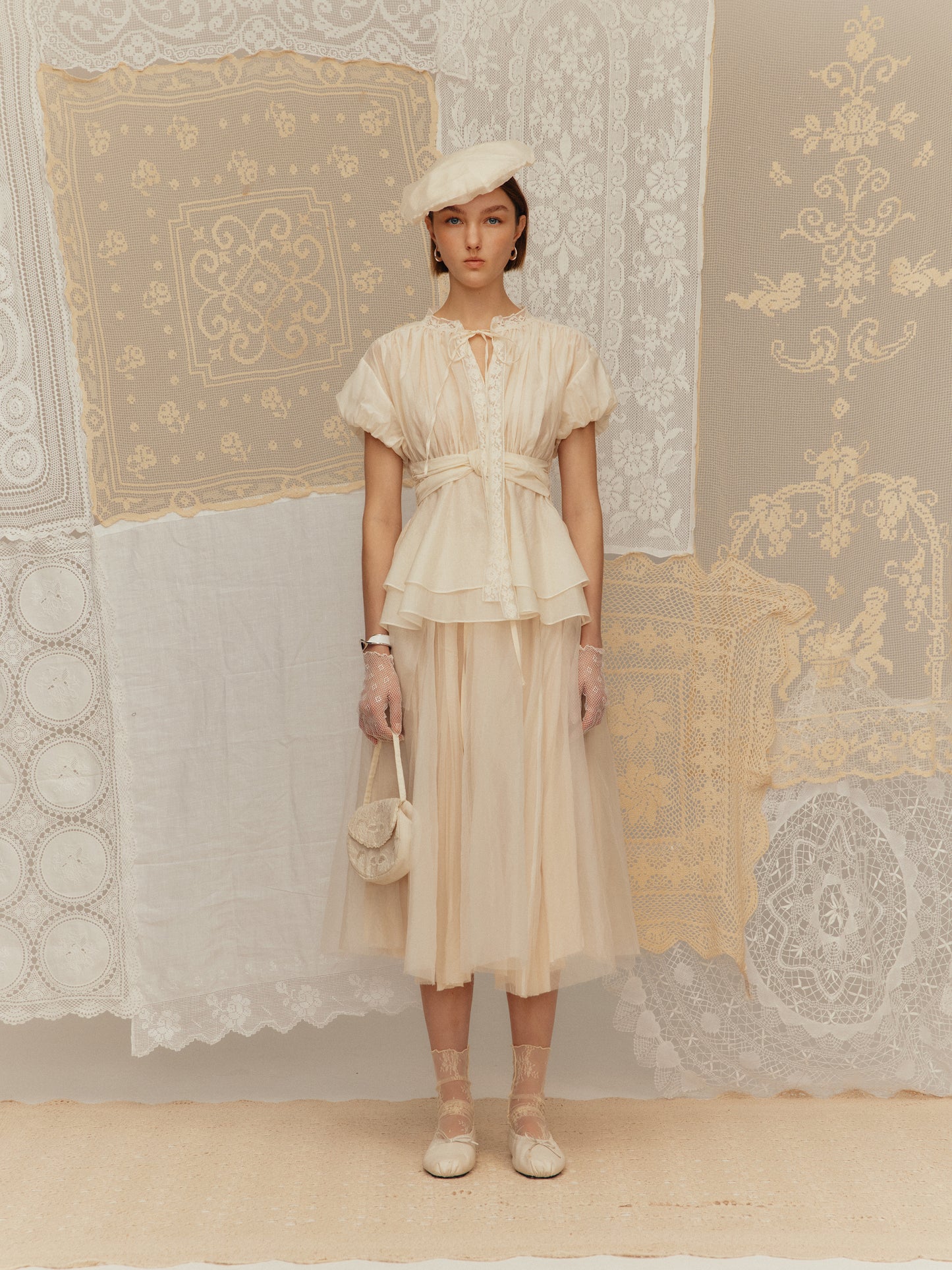 Sleeveless silk cotton top with a ruched collar and a cinched waist