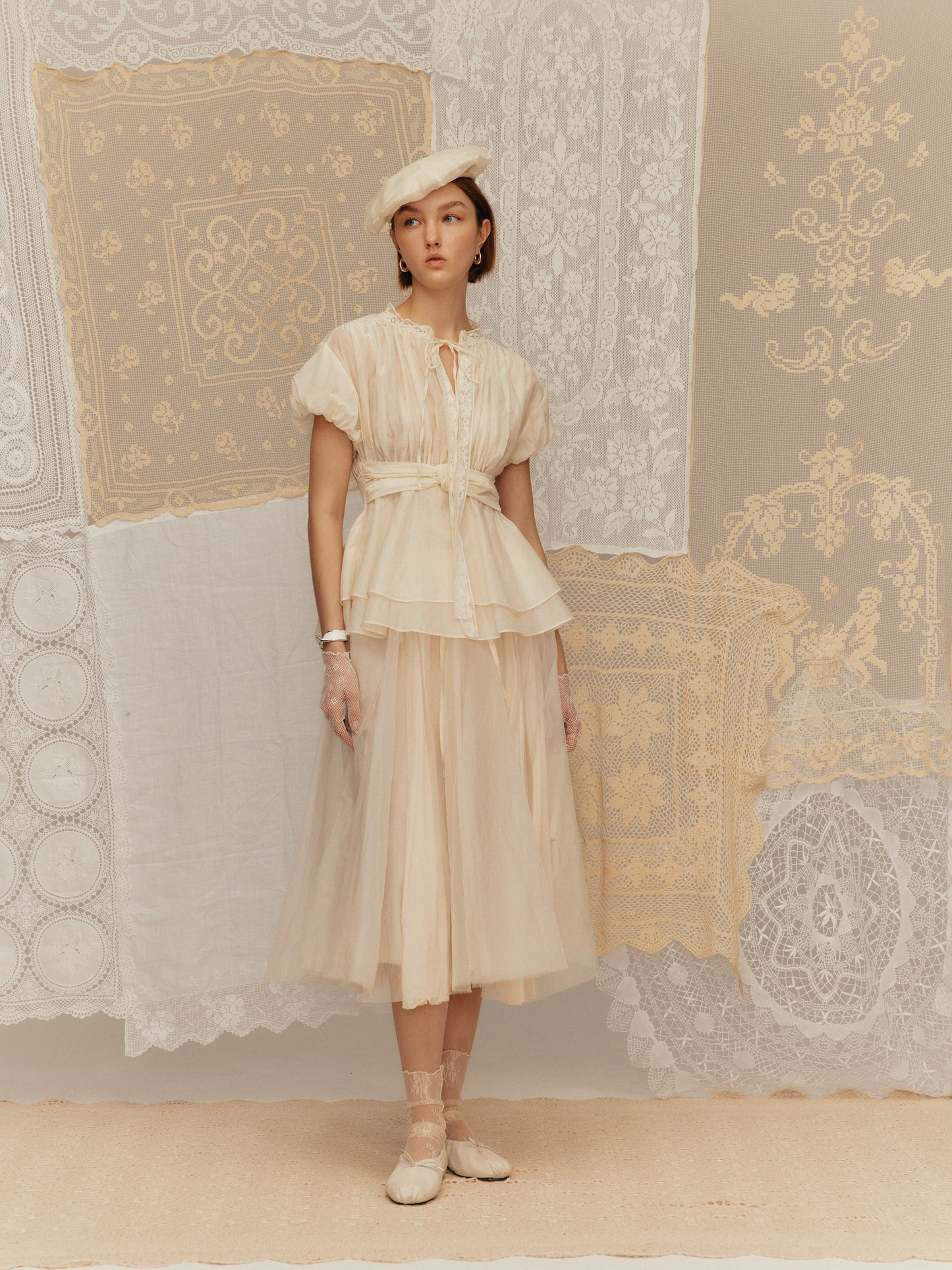 Sleeveless silk cotton top with a ruched collar and a cinched waist