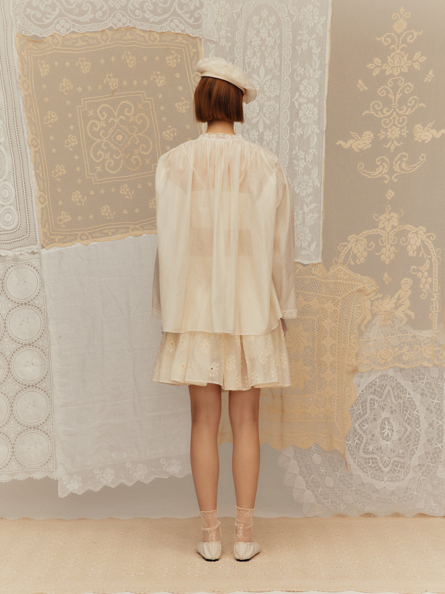 A-line short skirt made of silk-cotton fabric with floral patterns and embroidery