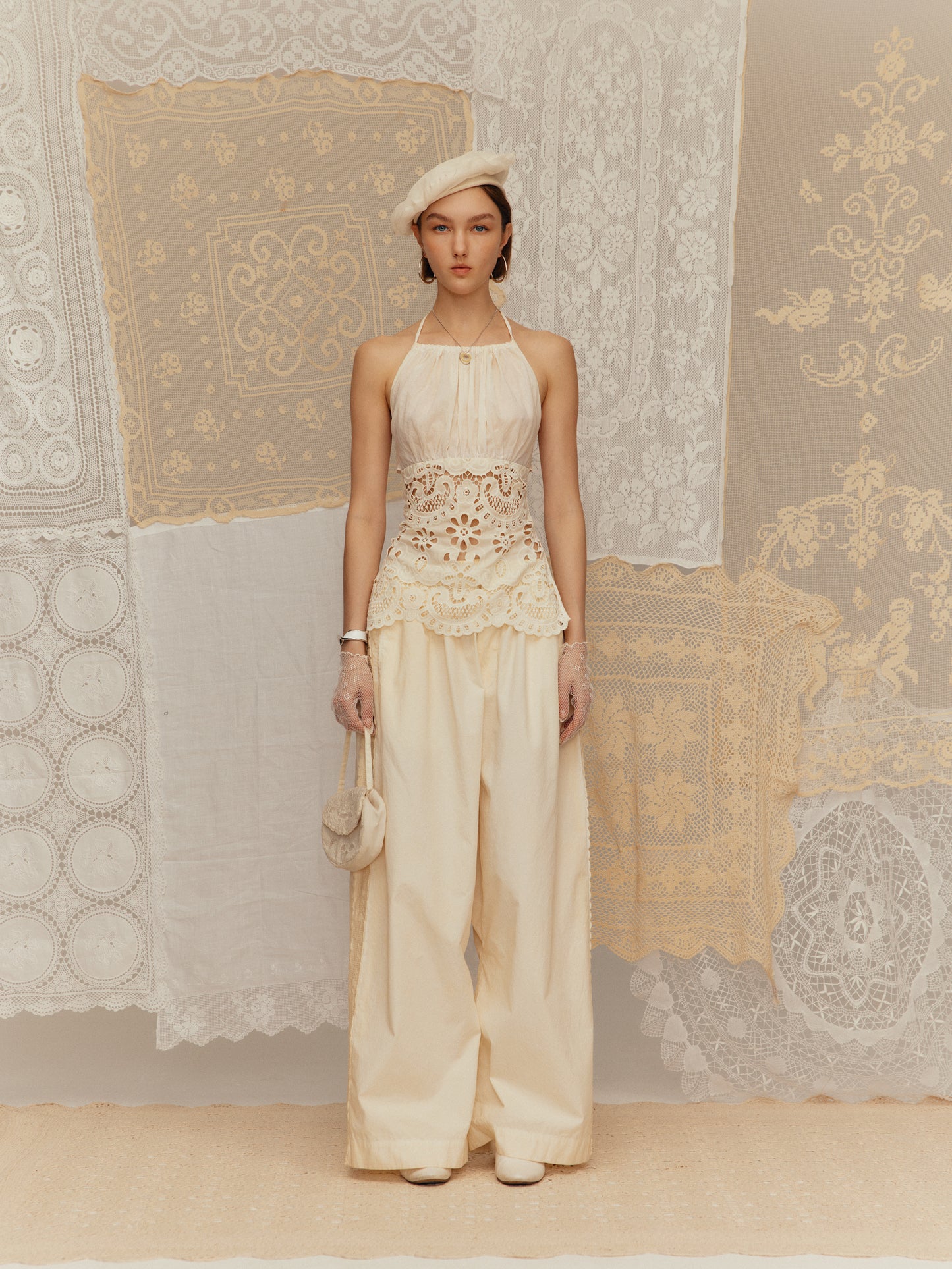 Cold-dyed with frilly ruffled collar, cinched waist and halter neck design