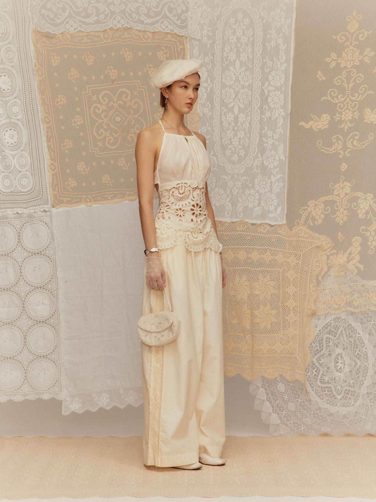 Cold-dyed with frilly ruffled collar, cinched waist and halter neck design