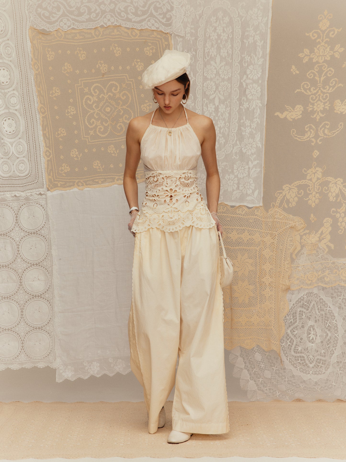 Cold-dyed with frilly ruffled collar, cinched waist and halter neck design