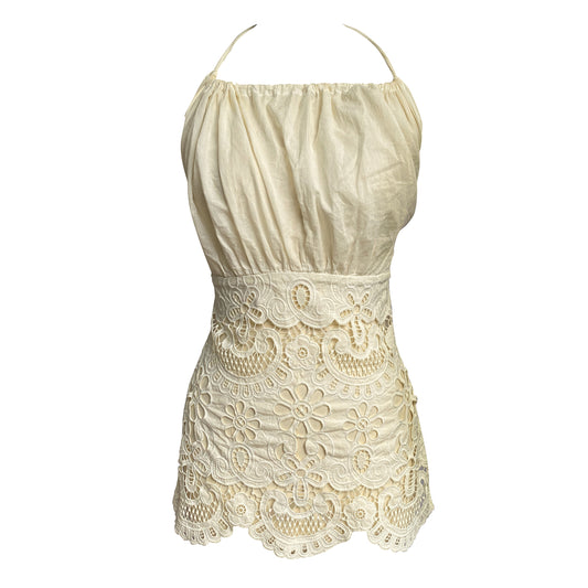 Cold-dyed with frilly ruffled collar, cinched waist and halter neck design